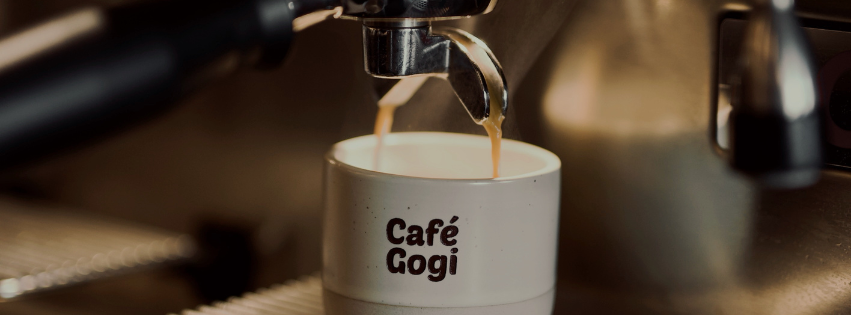 Fresh espresso pouring into a Café Gogi cup