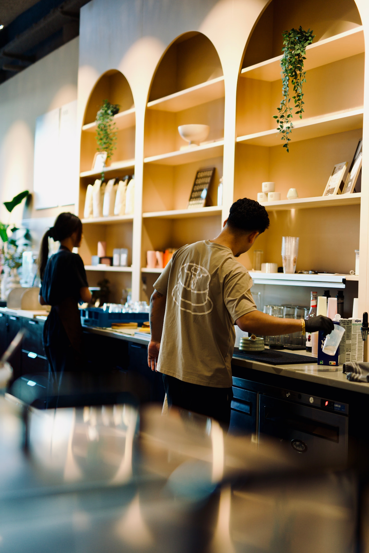 Café Gogi team members at work behind the bar